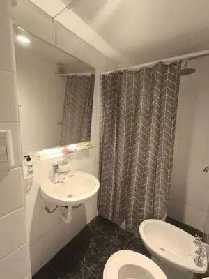 a bathroom with a sink and a toilet at Refugio en el centro in Cordoba