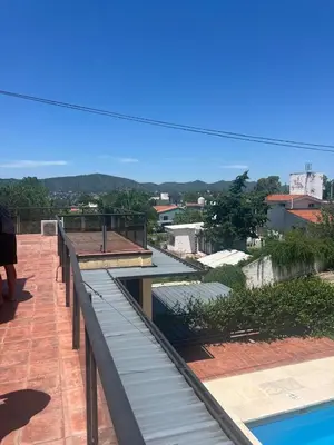 a view from the roof of a house with a swimming pool at El Descanso in Villa Carlos Paz