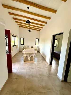 a living room with a table and a couch at La Corrida hospedaje in San Javier