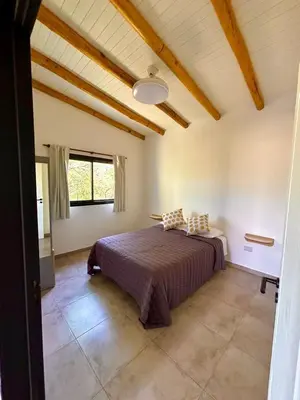 a bedroom with a bed in a room at La Corrida hospedaje in San Javier