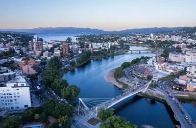 a city with a bridge over a river at Departamento en Carlos Paz, céntrico in Villa Carlos Paz