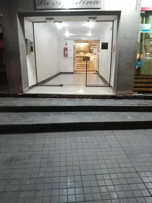 an empty hallway of a building with stairs in it at Departamento en Carlos Paz, céntrico in Villa Carlos Paz