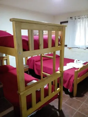 a pair of bunk beds in a room at Complejo Don Emilio in Los Reartes