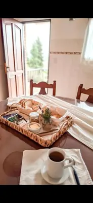a tray of food on a table with a cup of coffee at Chañares Complejo de Montaña - Solo Familias y Parejas in Villa Carlos Paz