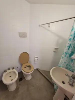a bathroom with a toilet and a sink at departamento centro zona tribunales cordoba in Cordoba