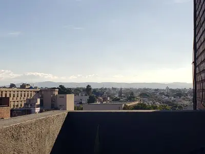 a view of a city from a building at Departamento céntrico con hermosa vista a las Sierras in Cordoba