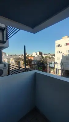 a room with a balcony with a view of a city at Anicca Alberdi Córdoba Centro in Cordoba