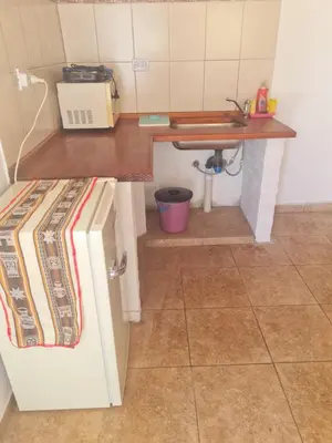 a small kitchen with a counter and a sink at Dálet in Villa Parque Siquiman