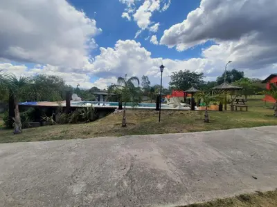 a park with a playground and a swimming pool at Cabañas Tanti in Tanti