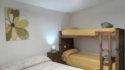 a bedroom with two bunk beds in a room at Las vasijas in Villa Amancay
