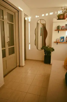 a hallway with a mirror on the wall at Hostel céntrico Casa Revol in Cordoba