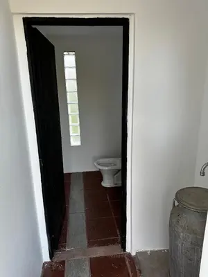an open doorway to a bathroom with a toilet at Real del Cóndor San Clemente in San Clemente