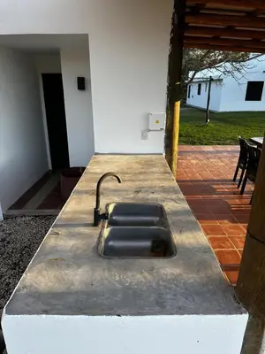 a kitchen sink in the middle of a patio at Real del Cóndor San Clemente in San Clemente
