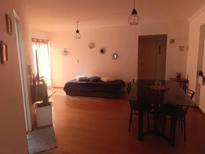a living room with a bed and a table at Nueva Córdoba Ambrosio Olmos 898 pleno bv a metros de plaza España la universidad clínicas gastronomía etc etc in Cordoba