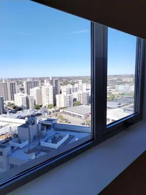 an open window with a view of a city at Depto 2 dormitorios a estrenar, amplio y luminoso in Cordoba