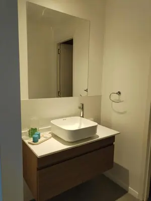 a bathroom with a white sink and a mirror at Depto 2 dormitorios a estrenar, amplio y luminoso in Cordoba