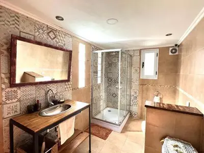 a bathroom with a sink and a shower at Casa alojamiento in Cordoba