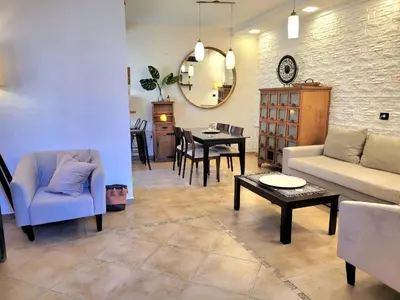 a living room with a couch and a table at Crin Blanca in Cordoba