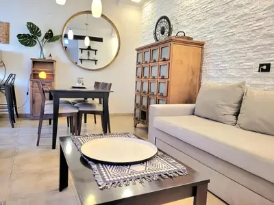 a living room with a couch and a table at Crin Blanca in Cordoba