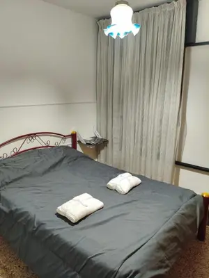 a bedroom with a bed with two pillows on it at Departamento Barrio General Paz in Cordoba