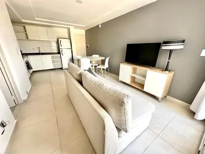 a living room with a couch and a flat screen tv at Alojamiento entero para 2 personas E in Cordoba