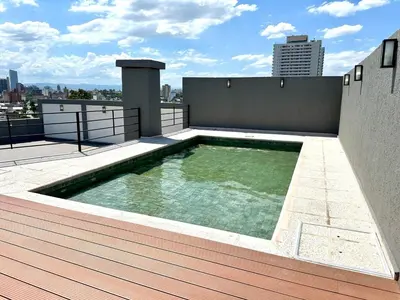 a swimming pool on the roof of a building at Alojamiento entero para 2 personas E in Cordoba