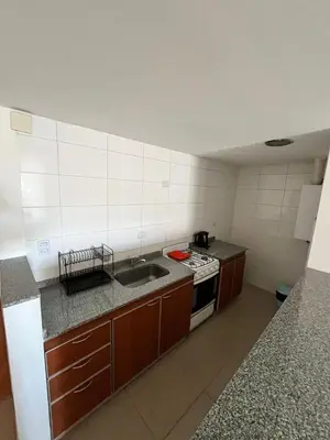 a small kitchen with a sink and a stove at Jardines del Boulevard 6 in Cordoba