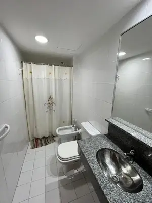 a bathroom with a sink and a toilet and a shower at Jardines del Boulevard 6 in Cordoba