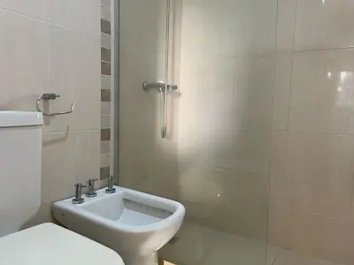 a bathroom with a shower with a toilet and a sink at Departamento en Altos de Villa Sol y Seguridad 24h - Córdoba, Argentina in Cordoba