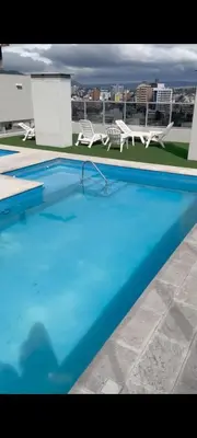 a large blue swimming pool on top of a building at Espacio PAN in Villa Carlos Paz