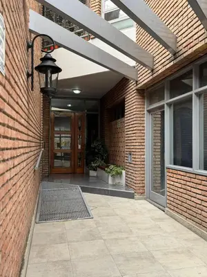 an entrance to a brick building with a front door at Ayacucho loft in Cordoba