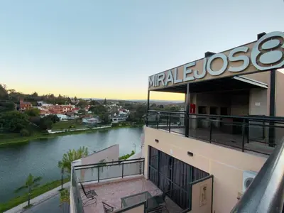 a view of a river from the balcony of a building at Departamento con cochera y piscina centro Carlos Paz in Villa Carlos Paz