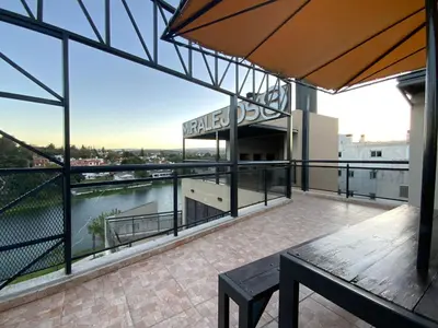 a view from the balcony of a building at Departamento con cochera y piscina centro Carlos Paz in Villa Carlos Paz