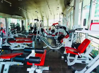 a gym with lots of red and white exercise bikes at Alquiler del Departamento Barrio residencial in Cordoba
