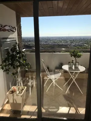 a view of a balcony with a table and chairs at Alquiler del Departamento Barrio residencial in Cordoba