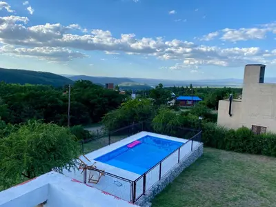 a swimming pool on the roof of a house at Nuestro lugar en Traslasierra in Los Hornillos