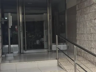 a glass door of a building with a staircase at Departamento en Complejo Villa Sol in Cordoba