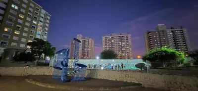 a blue sculpture in front of some tall buildings at Departamento en Complejo Villa Sol in Cordoba