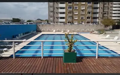 a swimming pool on the roof of a building at Departamento en Complejo Villa Sol in Cordoba