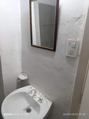 a bathroom with a white sink and a mirror at Violeta in Cordoba