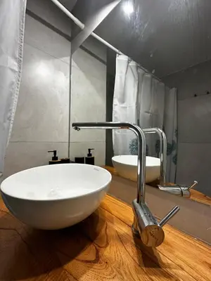 a bathroom with a white sink and a mirror at Monoambiente en el centro de Córdoba in Cordoba