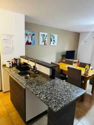 a kitchen with a sink and a counter top at Departamento Carlos Paz in Villa Carlos Paz
