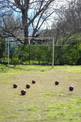 a group of balls on a field with a soccer goal at cabañas Samay-Piskho in Santa Rosa de Calamuchita
