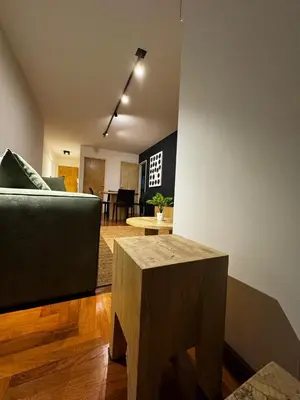 a living room with a couch and a table at Modern apartment - Nueva Córdoba in Cordoba