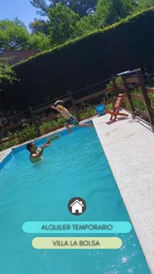 a couple of people in a swimming pool at la riviere in Alta Gracia