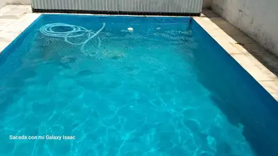 a swimming pool with a ball in the water at La Gregoria in Carpintería