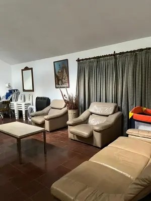 a living room with couches and a couch and a table at La Gregoria in Carpintería