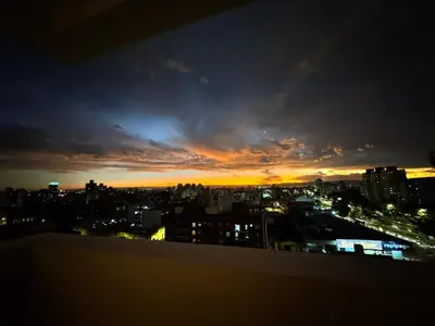 a view of a city skyline at sunset at Avellaneda Homestay in Cordoba