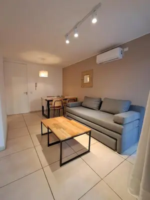 a living room with a couch and a table at Chacabuco 400 B Nueva Cordoba in Cordoba
