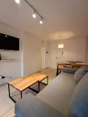 a living room with a couch and a table at Chacabuco 400 B Nueva Cordoba in Cordoba